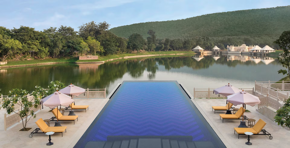 The Oberoi Rajgarh Palace pool overlooking the lake